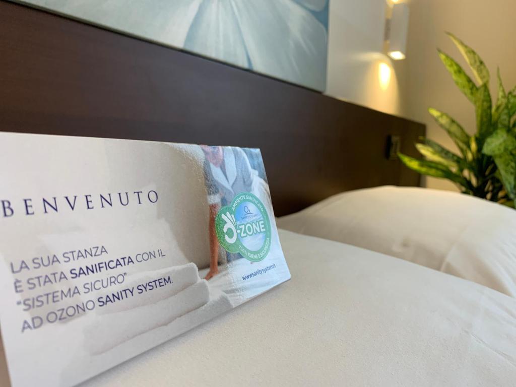 Postel nebo postele na pokoji v ubytování Hotel Corallo