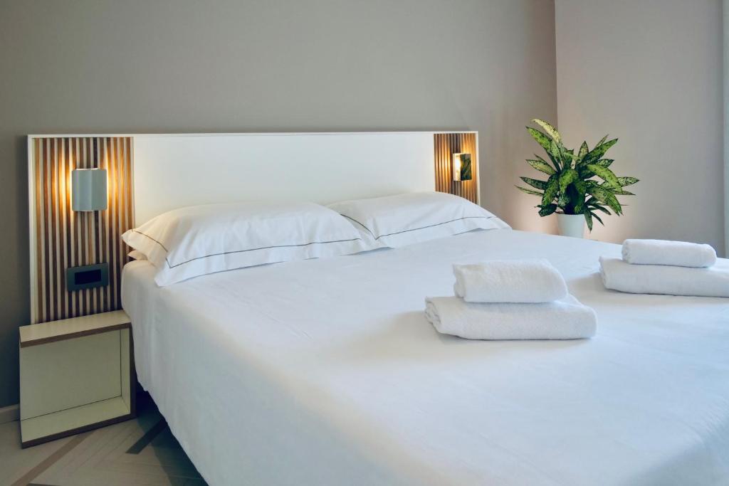 Postel nebo postele na pokoji v ubytování Hotel Corallo