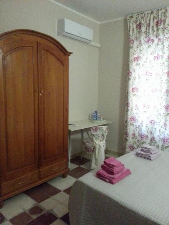 Postel nebo postele na pokoji v ubytování Sassari-In
