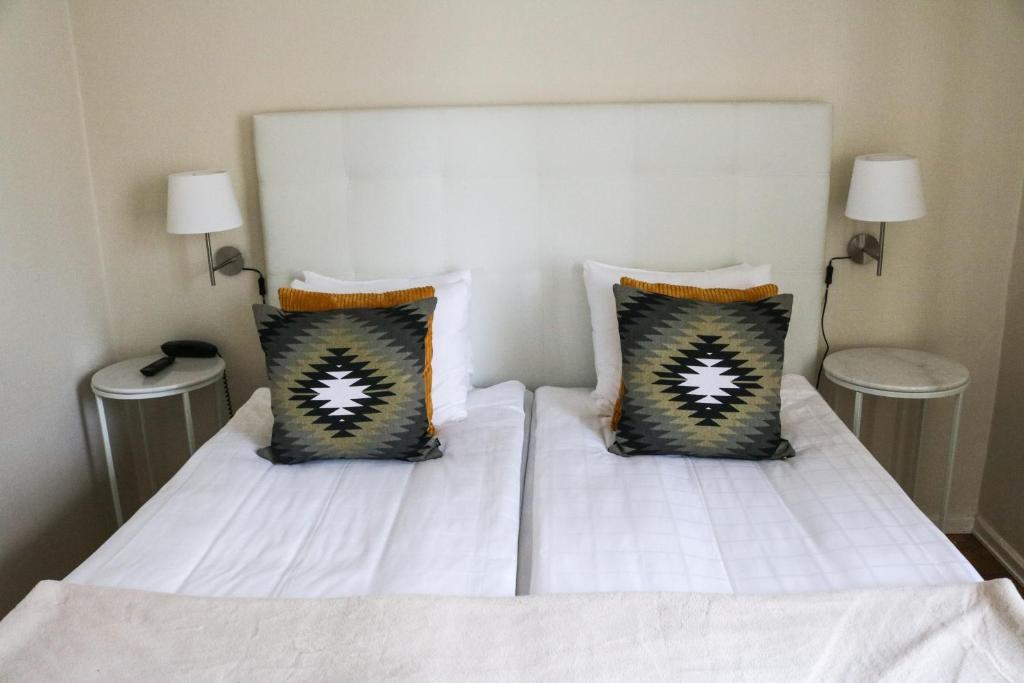 Postel nebo postele na pokoji v ubytování Mora Hotell & Spa