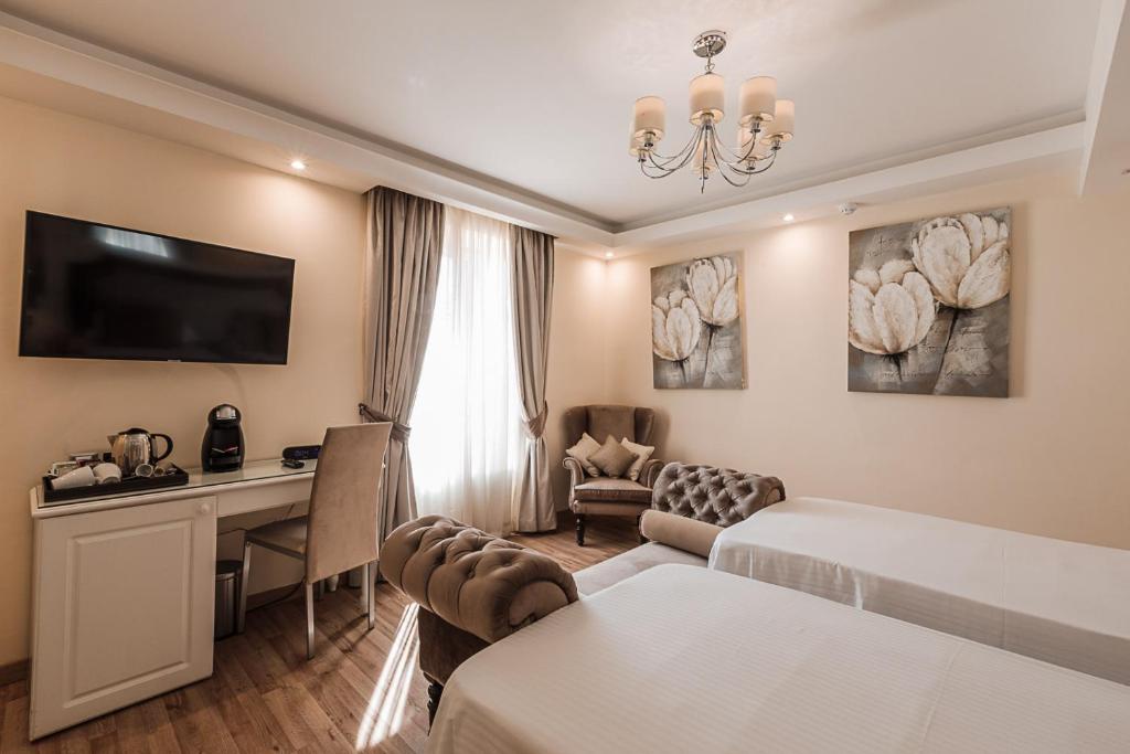 Postel nebo postele na pokoji v ubytování Osborne Hotel