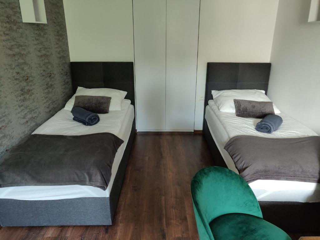 Łóżko lub łóżka w pokoju w obiekcie Apartament Studio 11 Starówka Konin