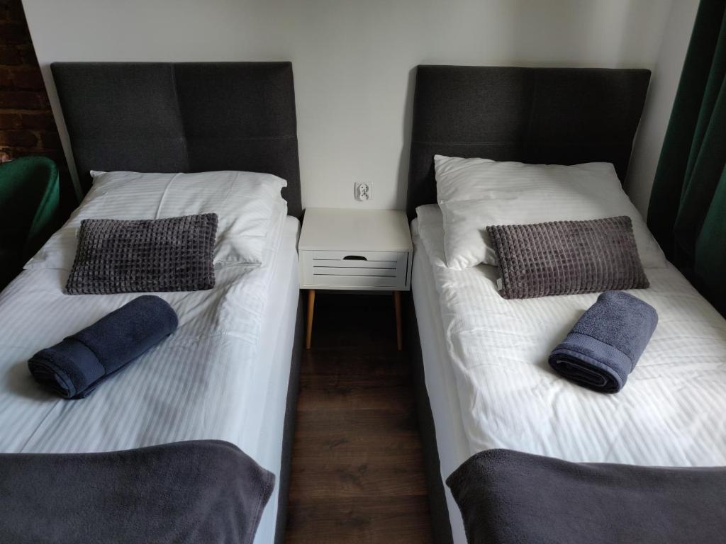 Łóżko lub łóżka w pokoju w obiekcie Apartament Studio 11 Starówka Konin