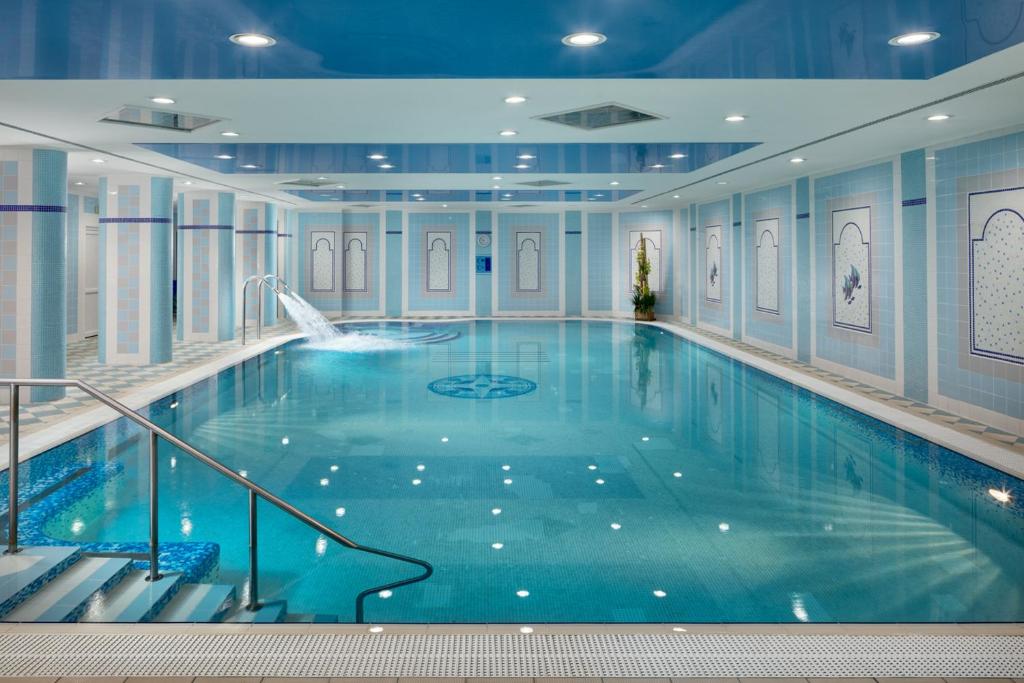 a large swimming pool in a hotel room at Ensana Hotel Pacifik in Mariánské Lázně