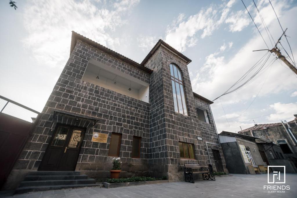 a church with a brick building at Gyumri apart in Gyumri