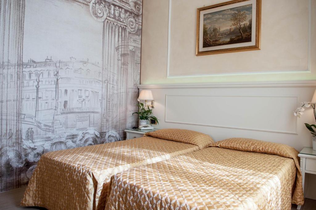 Postel nebo postele na pokoji v ubytování Hotel Palladium Palace