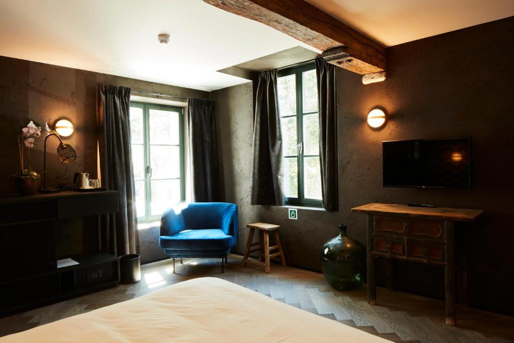 TV a/nebo společenská místnost v ubytování Nonam Boutique Hotel Gent