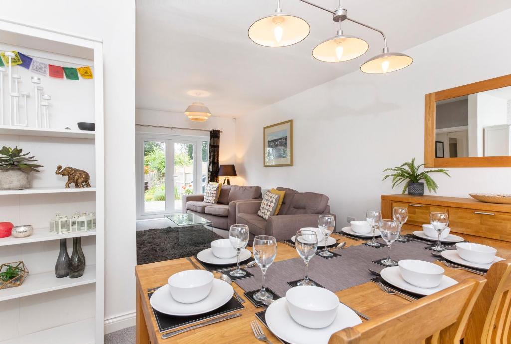 a dining room and living room with a table and chairs at Woodlea House with Free Parking in York