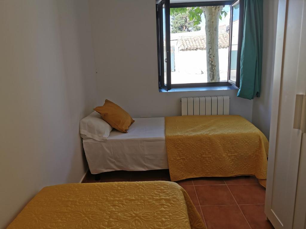Postel nebo postele na pokoji v ubytování CASITAS PINILLA DEL VALLE