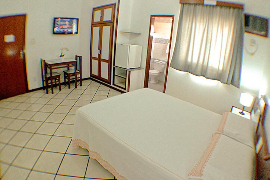Postel nebo postele na pokoji v ubytování Shalako Hotel