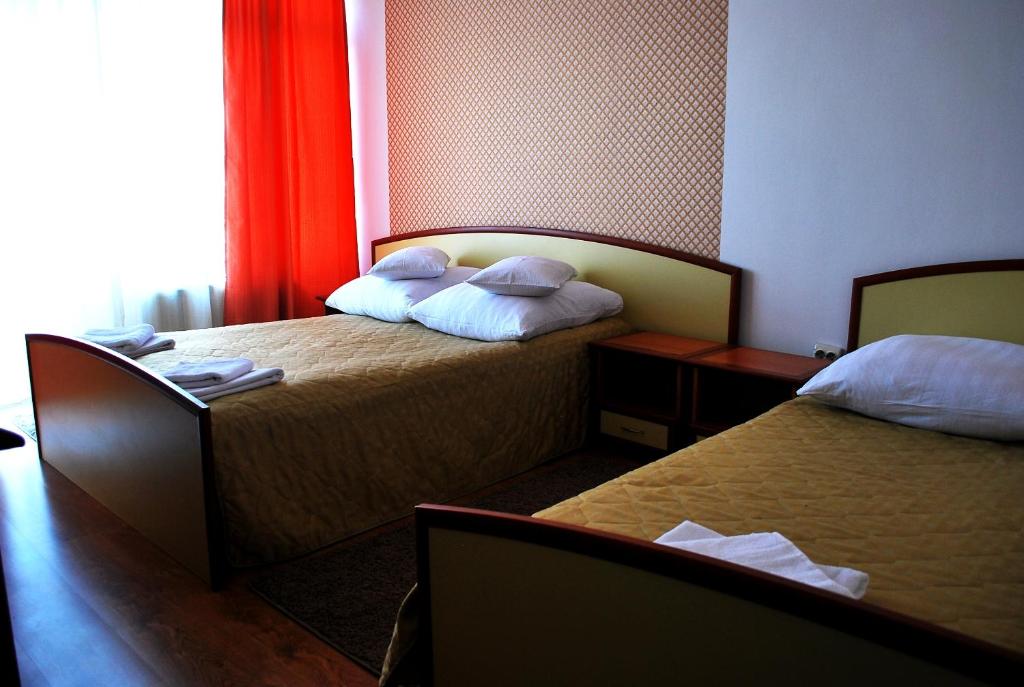 Postel nebo postele na pokoji v ubytování Vila Meteor