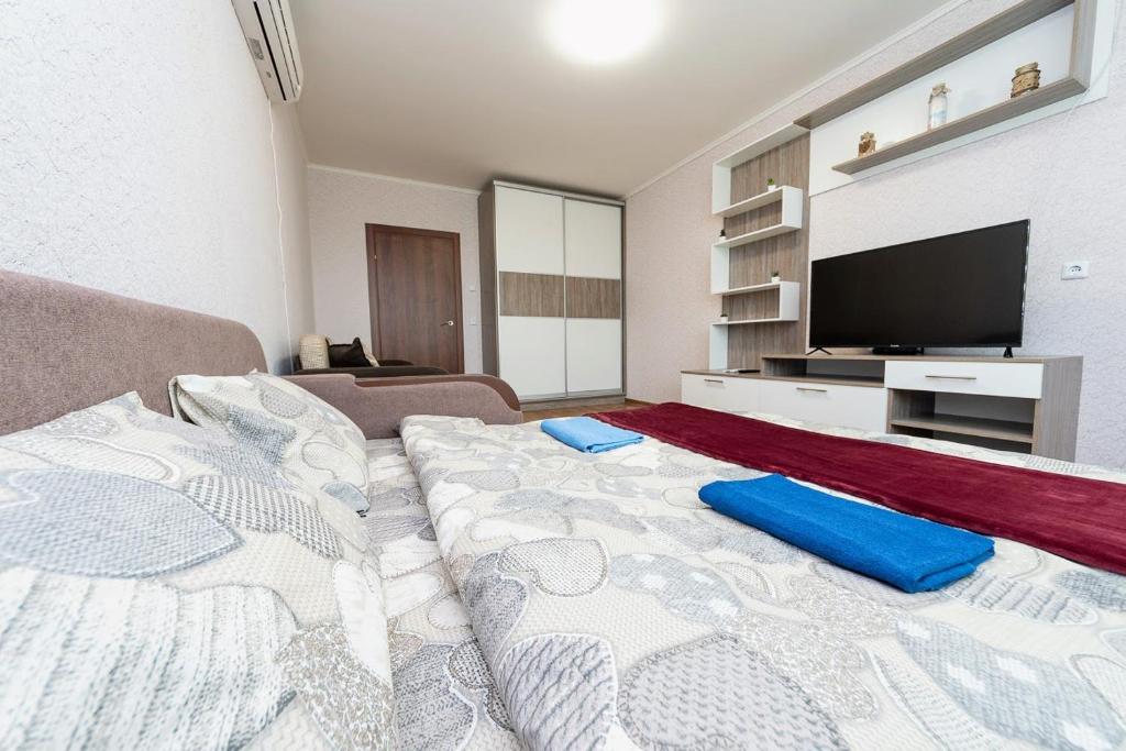 En eller flere senge i et værelse på Новая квартира переулок Ясиноватский 11