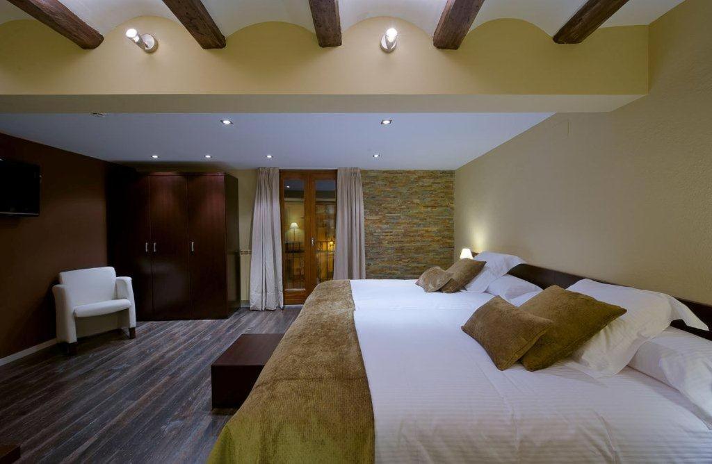 Postel nebo postele na pokoji v ubytování Hotel Cotori