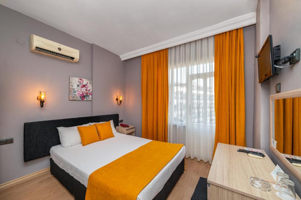 Postel nebo postele na pokoji v ubytování Yasemin Hotel