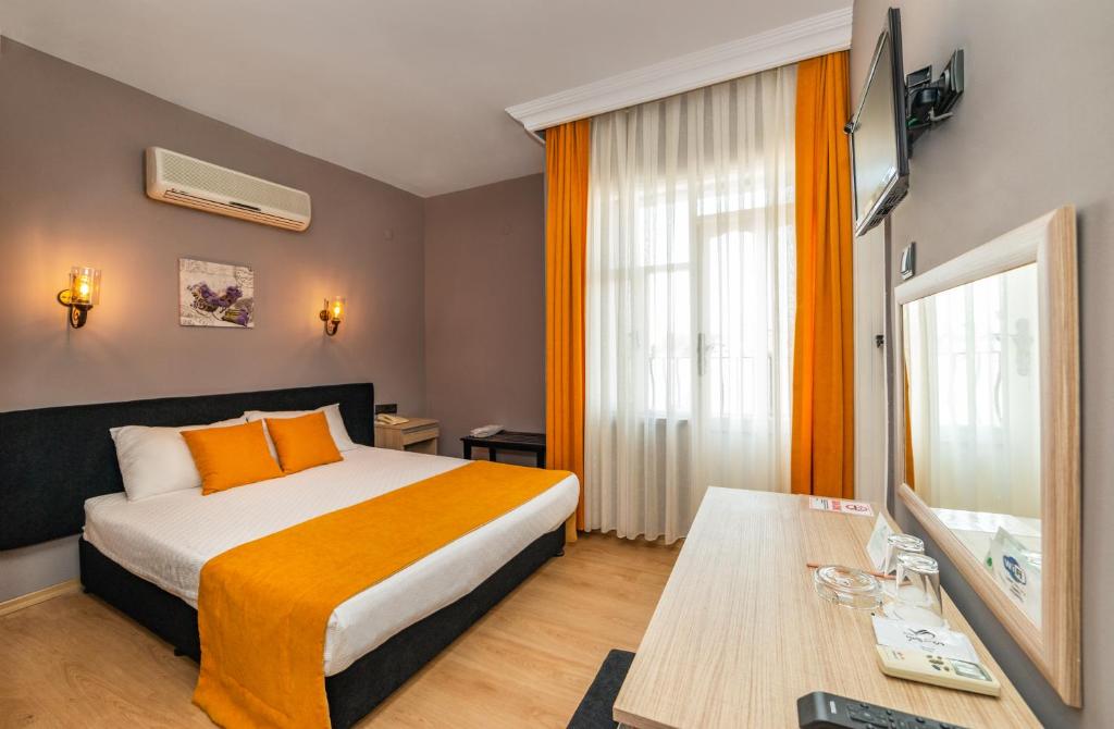 Postel nebo postele na pokoji v ubytování Yasemin Hotel
