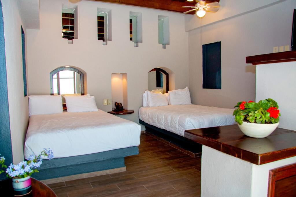 Postel nebo postele na pokoji v ubytování Hotel Sol y Fiesta