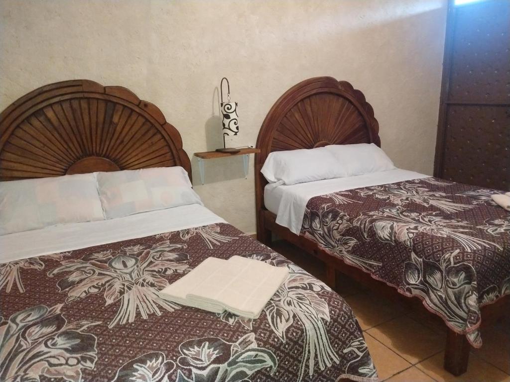 Postel nebo postele na pokoji v ubytování Hospedaje San Antonio Tepoztlán.