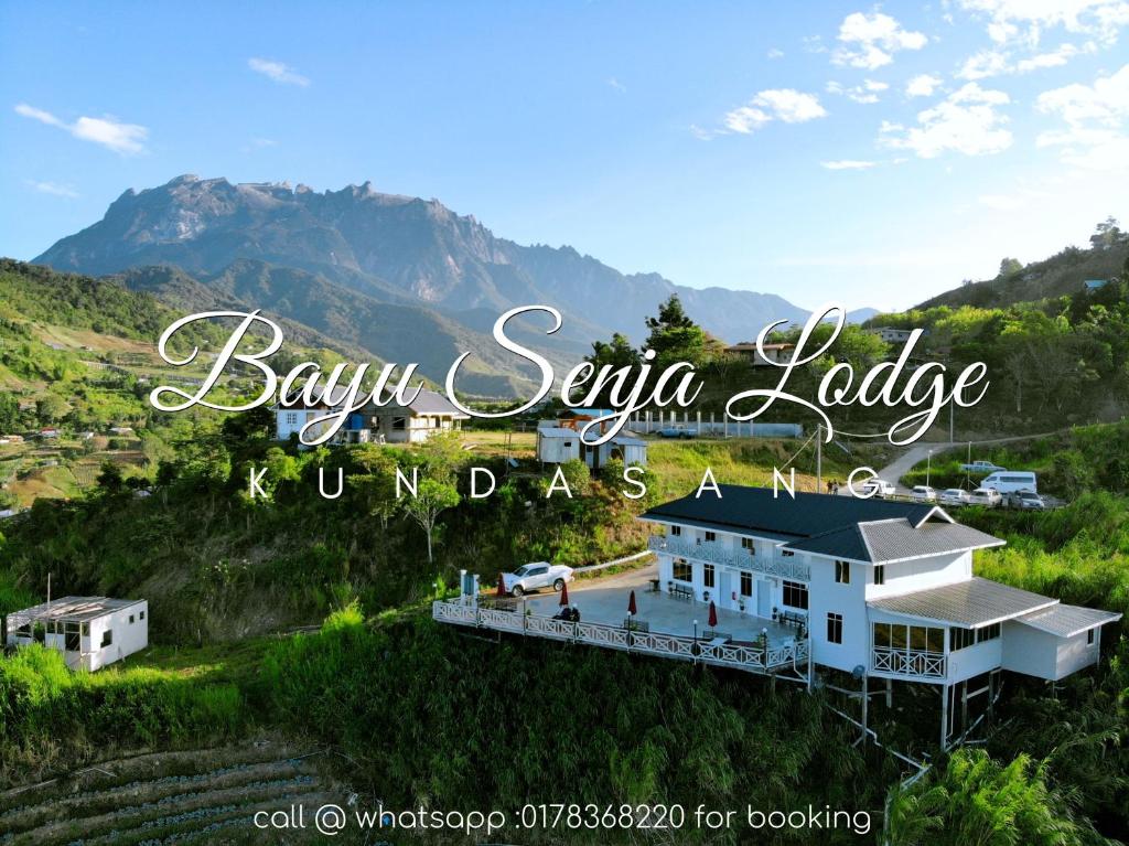 a sign that reads bahu savaya lodge in the mountains at Bayu Senja Lodge in Kundasang