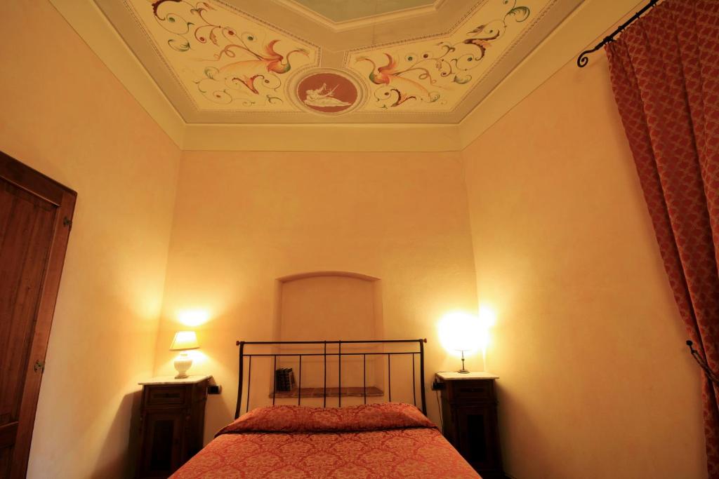 Postel nebo postele na pokoji v ubytování La Locanda di Quercecchio