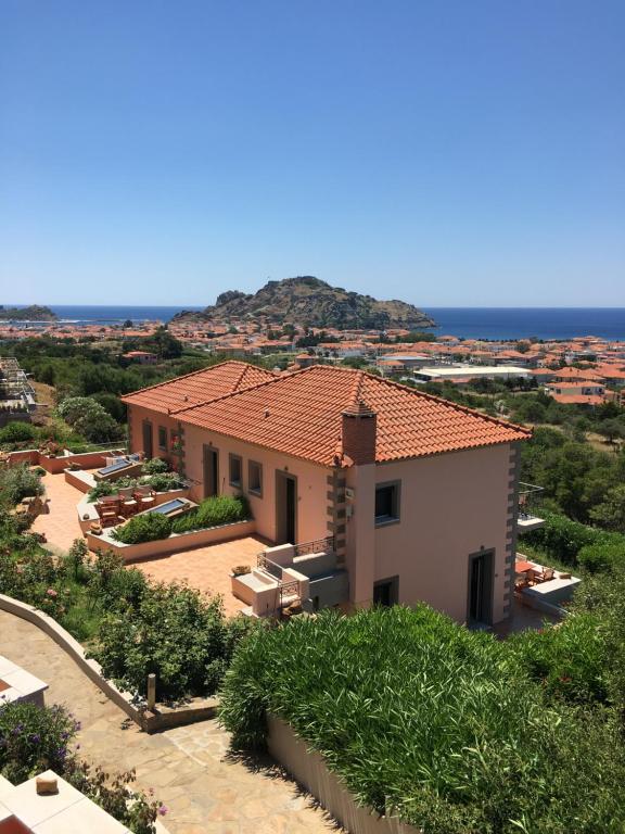 a house with a view of the ocean at Amigdalies in Myrina