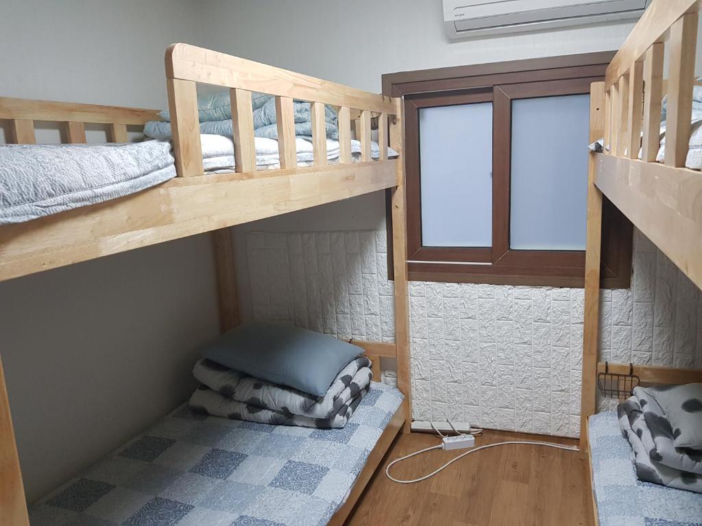 Postel nebo postele na pokoji v ubytování Friends of Loft