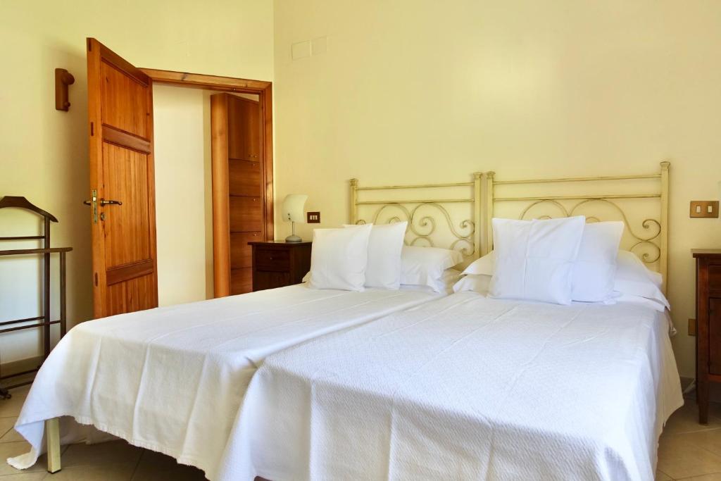 Postel nebo postele na pokoji v ubytování Casa GINESTRA a Bagno Vignoni