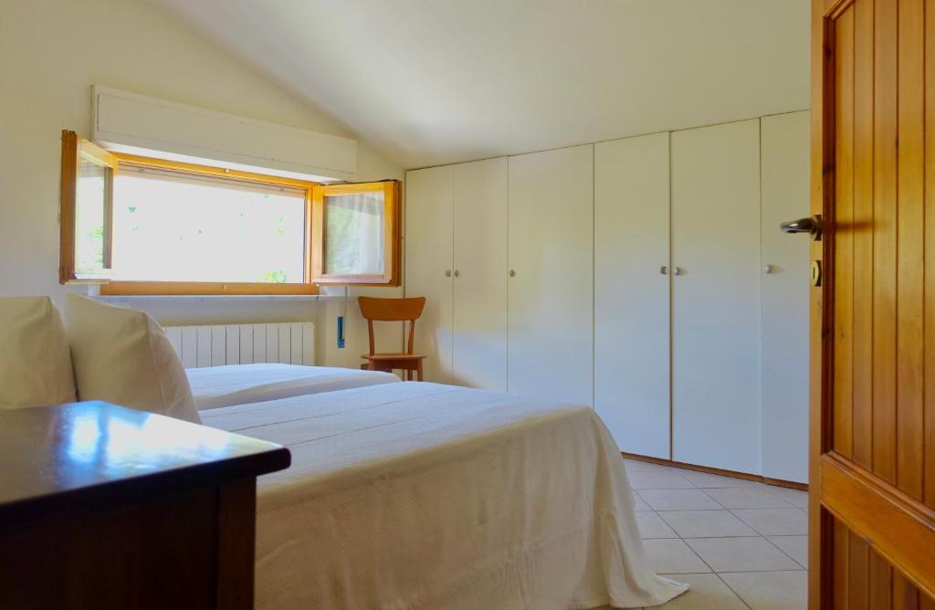 Postel nebo postele na pokoji v ubytování Casa GINESTRA a Bagno Vignoni