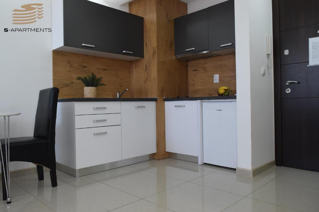 Kuchyň nebo kuchyňský kout v ubytování S-Apartmani Cocetova