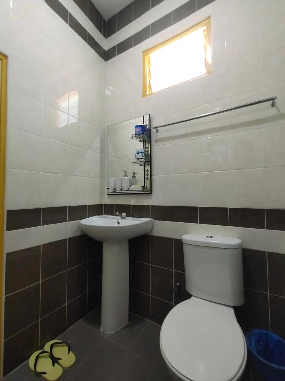 Koupelna v ubytování Ku's Roomstay