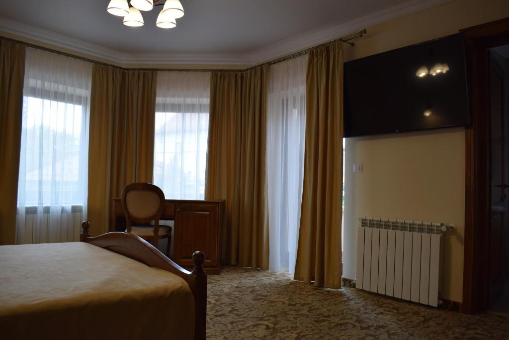 TV a/nebo společenská místnost v ubytování Vila Preciosa