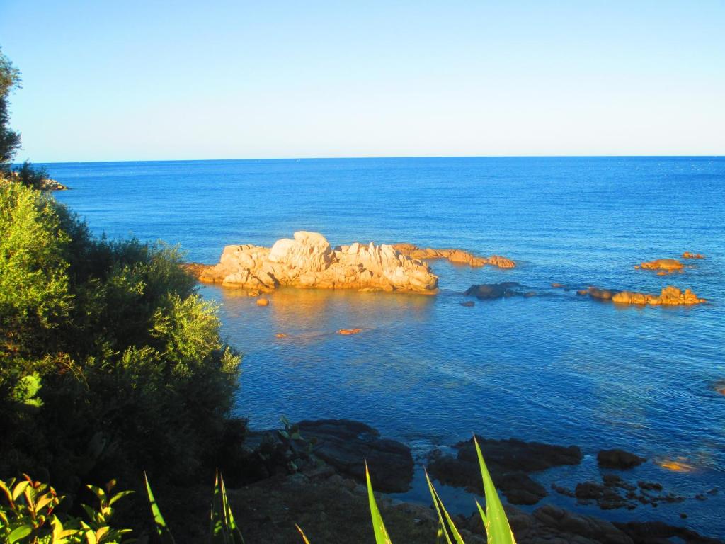 a group of rocks in the middle of the ocean at Casa Turusele in Santa Maria Navarrese