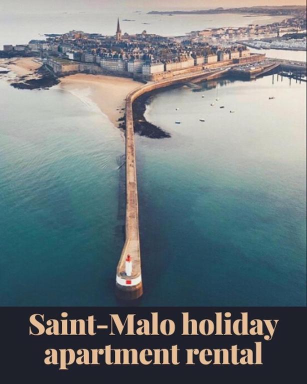 an aerial view of a beach with a boat in the water at La Mettrie in Saint Malo