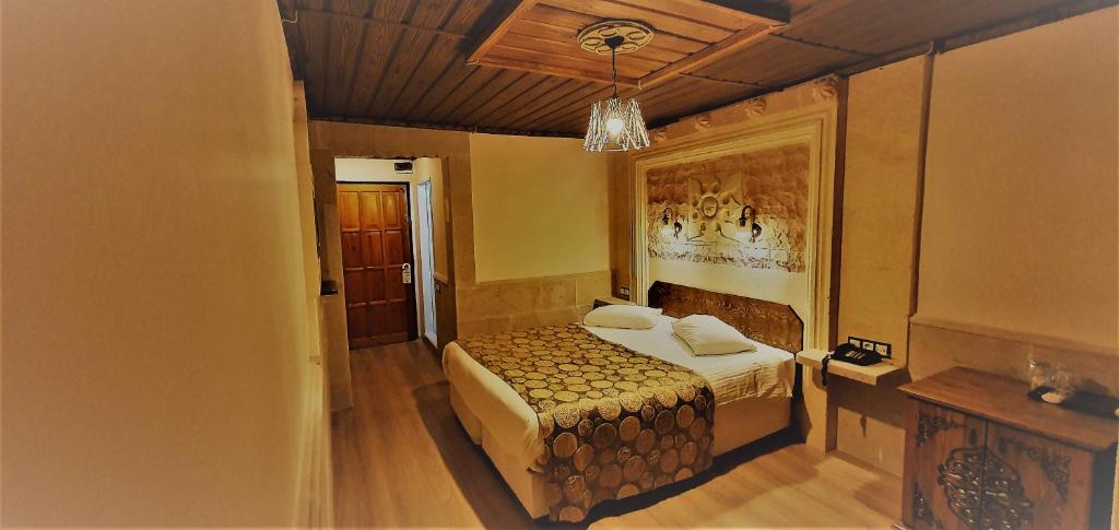 Postel nebo postele na pokoji v ubytování Ciner Hotel