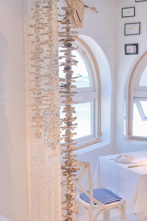 a curtain of wine bottles sitting on top of a chair at AVANTI Lifestyle Hotel - Only Adults in Corralejo