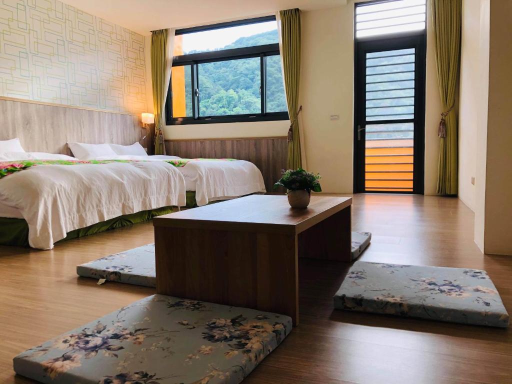 Postel nebo postele na pokoji v ubytování 南庄漫晨旅店Nanzhuang Manchen B&B