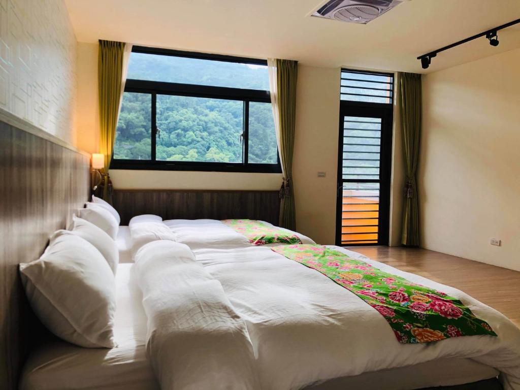 Postel nebo postele na pokoji v ubytování 南庄漫晨旅店Nanzhuang Manchen B&B