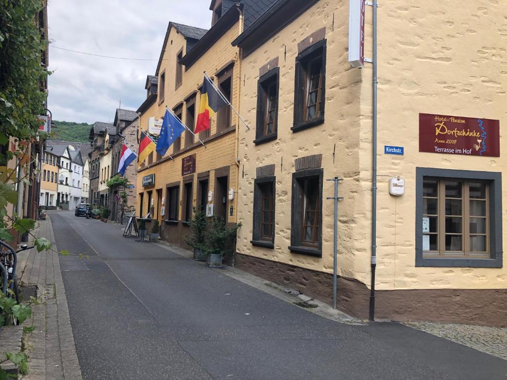 an empty street in a town with buildings at Hotel Zur Dorfschänke in Klotten