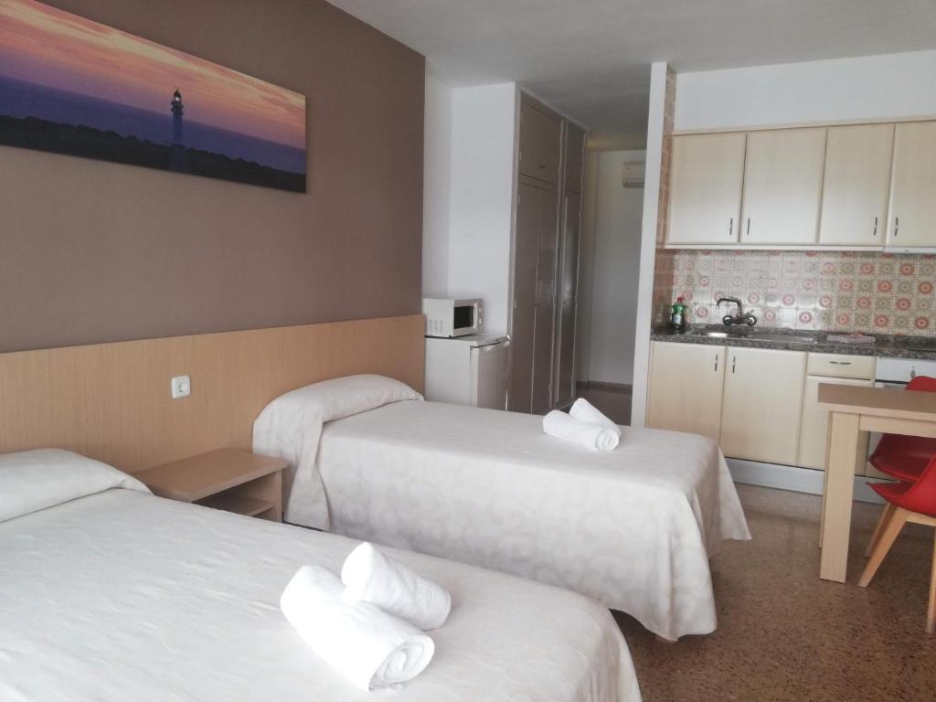 Postel nebo postele na pokoji v ubytování Apartamentos Orvay