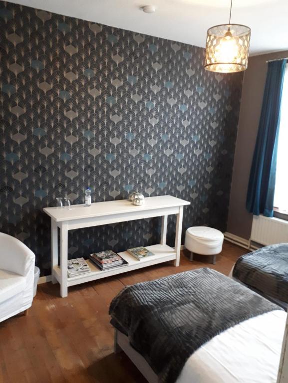 Postel nebo postele na pokoji v ubytování Beaux Temps b&b