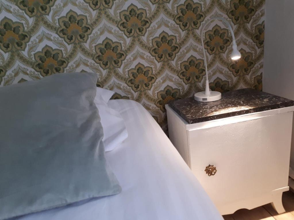 Postel nebo postele na pokoji v ubytování Beaux Temps b&b