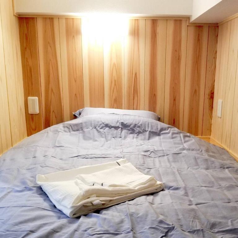 Postel nebo postele na pokoji v ubytování オレンジの風