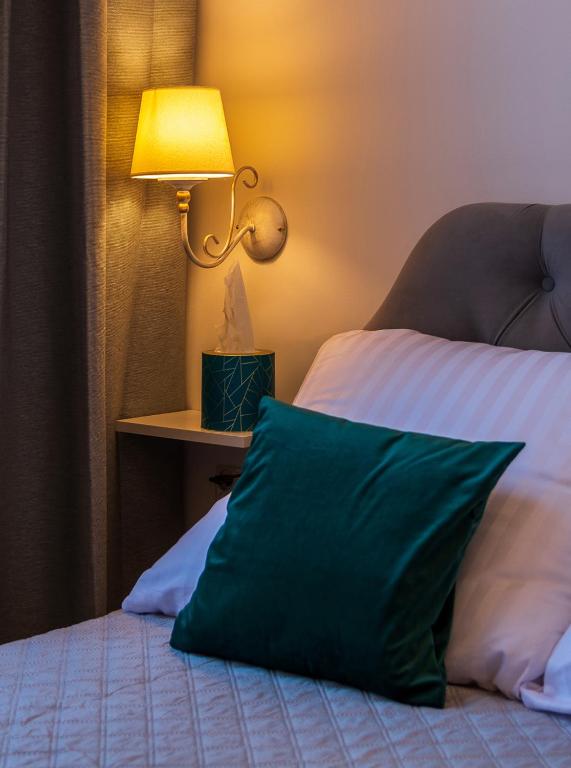 Posteľ alebo postele v izbe v ubytovaní Apartamenty Rejtana