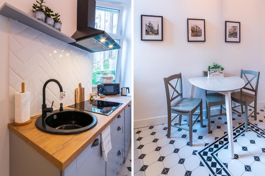 Kuchyňa alebo kuchynka v ubytovaní Apartamenty Rejtana