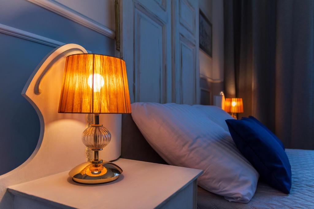 Posteľ alebo postele v izbe v ubytovaní Apartamenty Rejtana