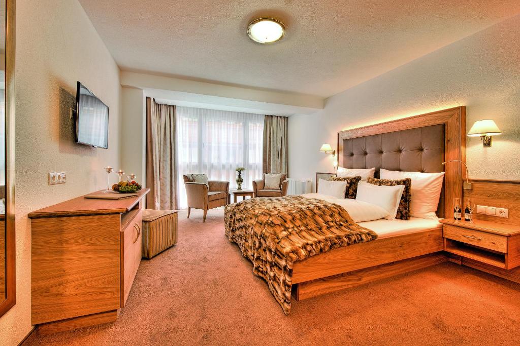 TV a/nebo společenská místnost v ubytování Hotel Garni Urezza