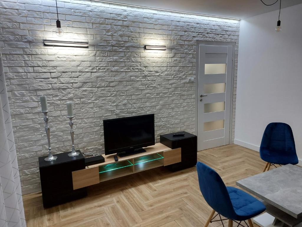 TV a/nebo společenská místnost v ubytování GS Apartament Olsztyn