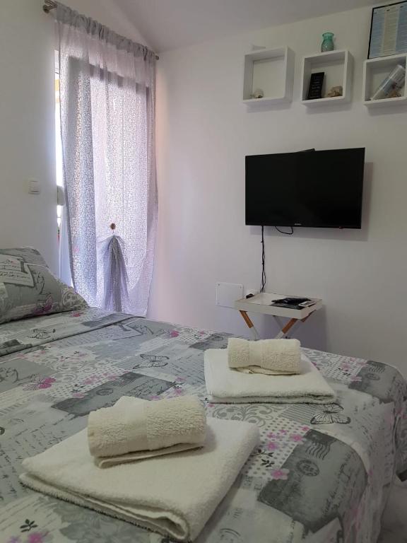Posteľ alebo postele v izbe v ubytovaní Studio Apartment Lili