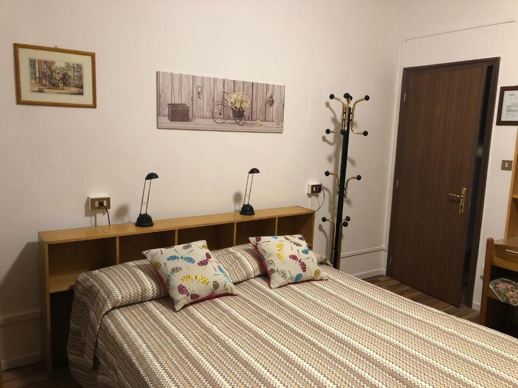 Postel nebo postele na pokoji v ubytování Alloggi Al Giardino & La Suite
