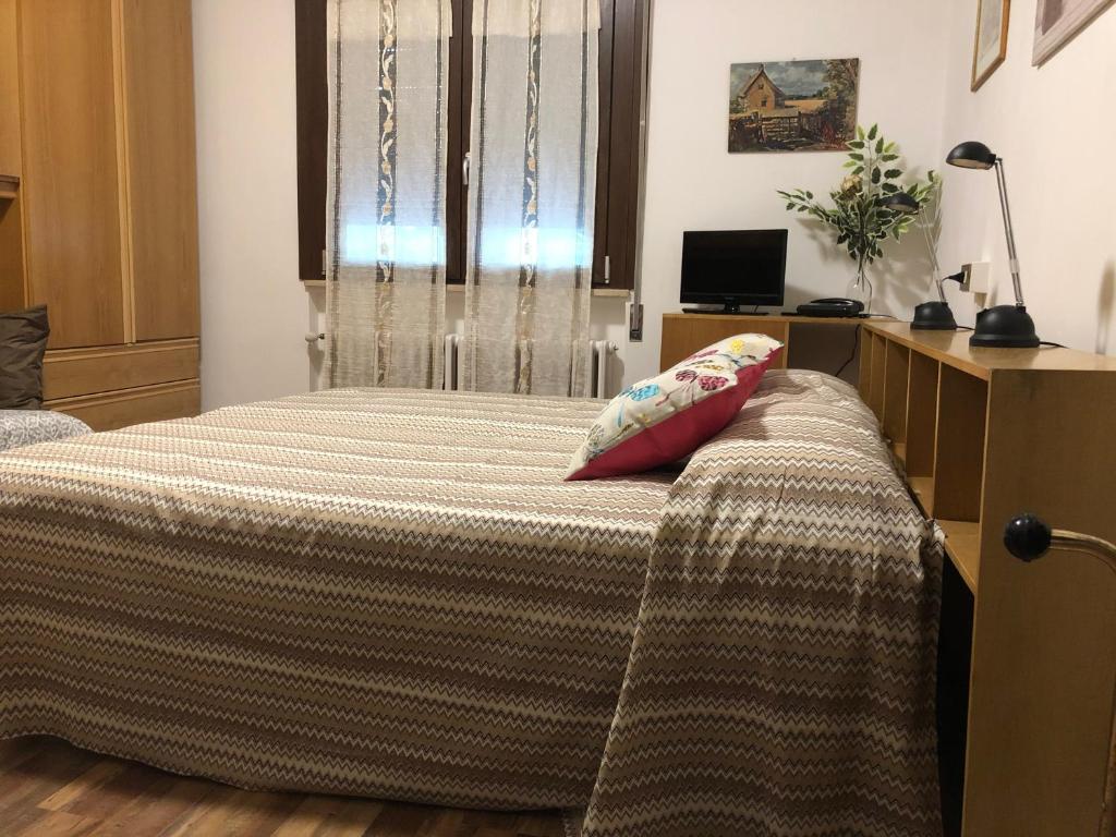 Postel nebo postele na pokoji v ubytování Alloggi Al Giardino & La Suite