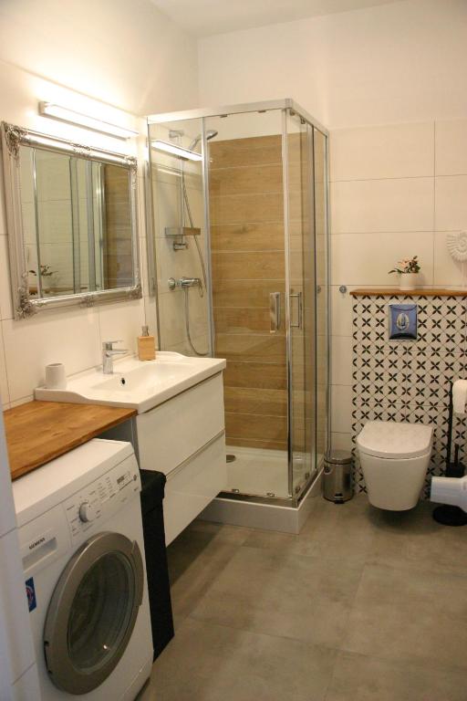 Kúpeľňa v ubytovaní Apartament zielony